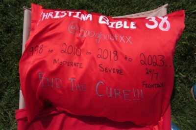 a red pillow with writing on it