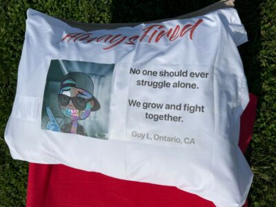 A pillowcase with a cartoon character on it No one should ever struggle alone We grow and fight together Guy L, Ontario, CA