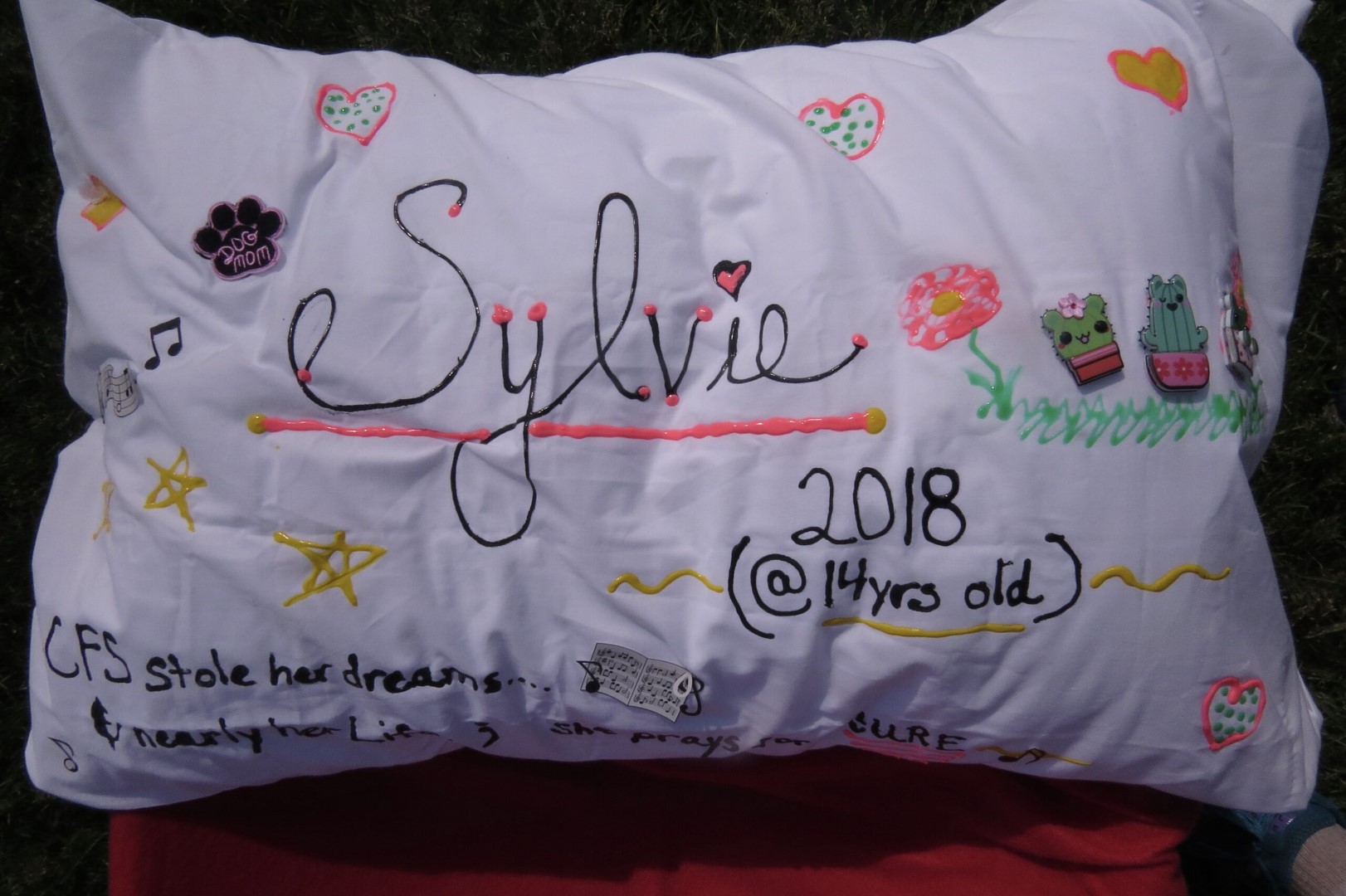 A white pillowcase with the name Sylvie embroidered on it